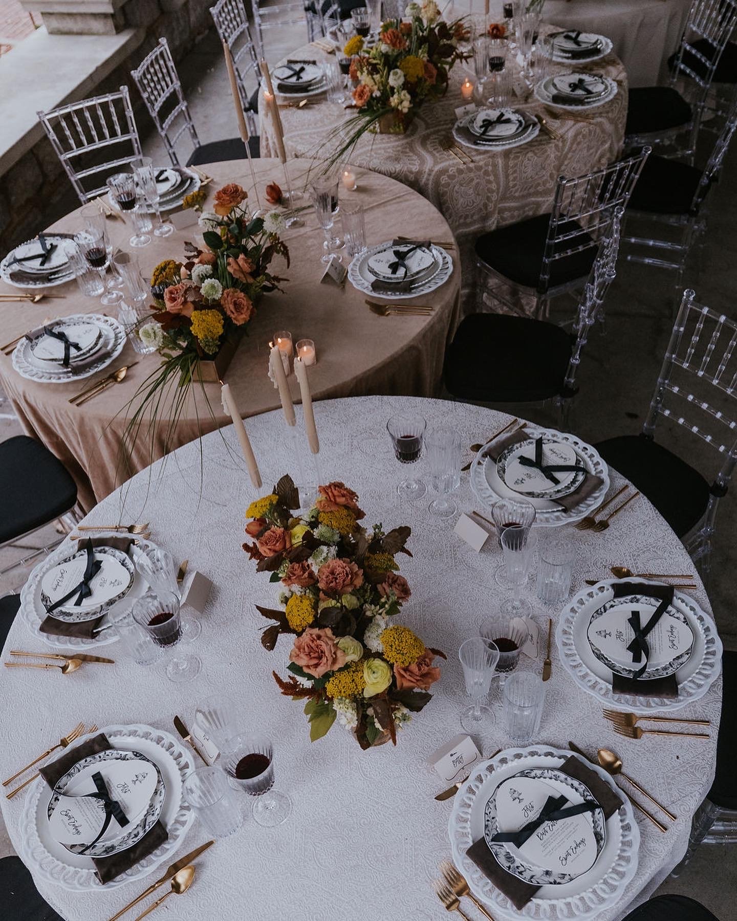 Elegant round table settings with autumn florals at the Peterson-Dumesnil House
