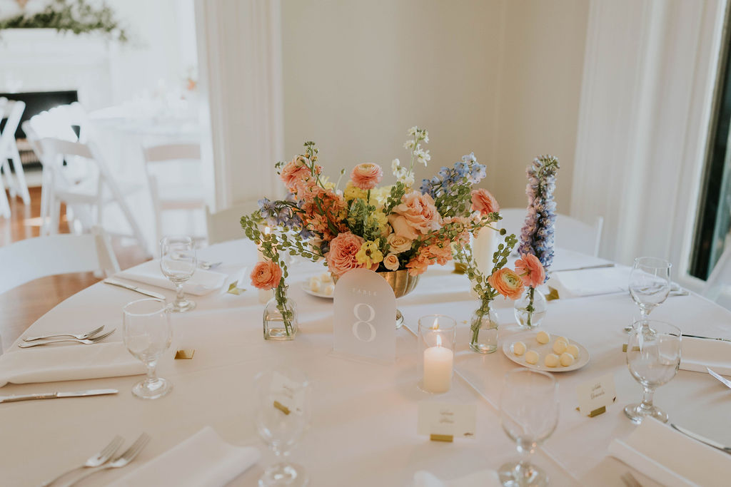 Elegant tablescape with pastel florals and candlelight